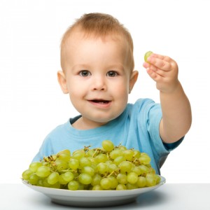 toddler eating fresh fruit